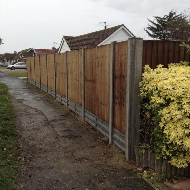 Close board panels on concrete posts and concrete gravel boards