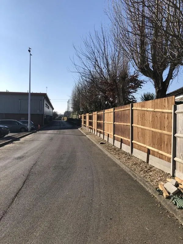 Bespoke close board fencing on concrete posts and gravel boards for a commercial residential client