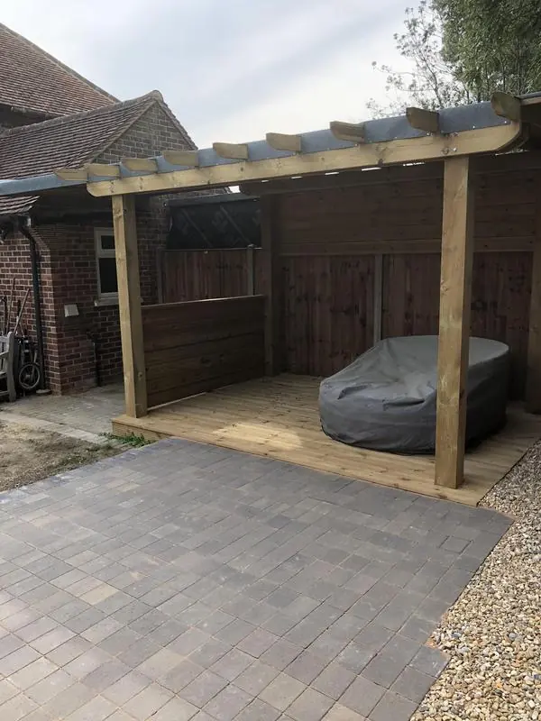 A covered, waterproof pergola with deck and patio