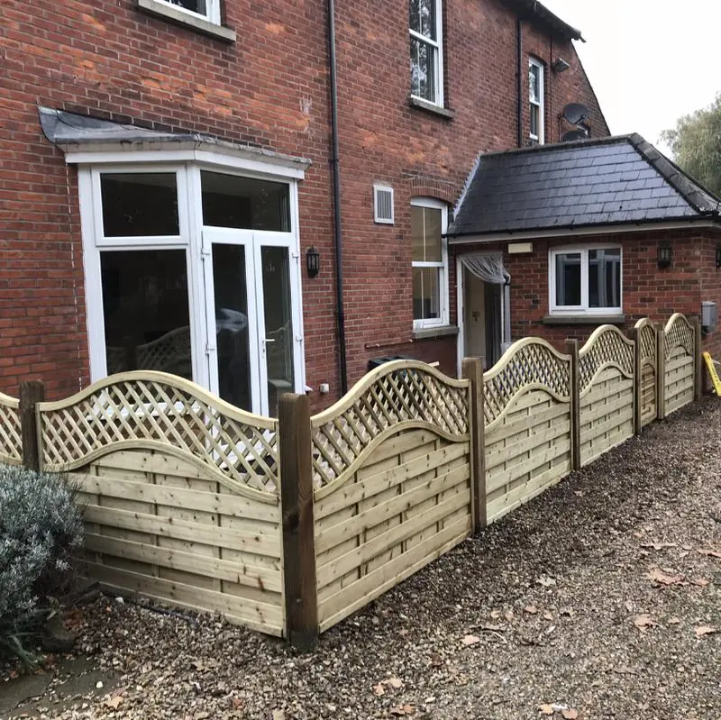 Decorative panels with a curved trellis top